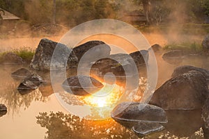 Sun reflecing on the Hot spring at national park during sunrise