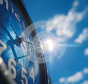 The sun is reflected in the wall clock