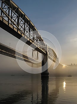 Sun reflecting on the Tamar Bridges in mist, Cornwall