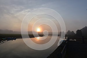 Sun Reflecting in the Water of Duxbury Bay on a Foggy Morning