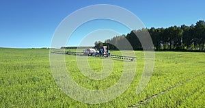 Sun reflection flashes in tractor trailed sprayer window