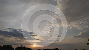 Sun rise in the cloudy sky