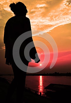 Sun rise with girl siluate photo