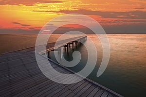 Sun rise sky and old wood bridge pier