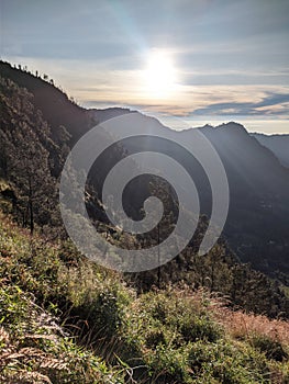 The sun rises in the beautiful mountains of Java