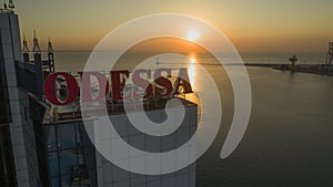 Sun rises behind large Odessa Sign Ukraine