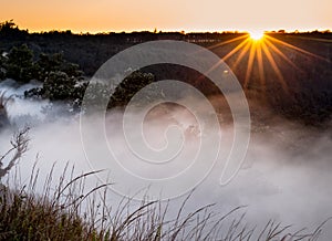 Sun rises over Steaming bluff overlook in Kilauea Crater.CR2