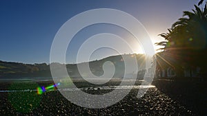 Sun rising above the scenic bays at Akaroa, Banks Peninsula