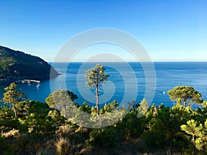 The first sun rays. The early morning view on the sea horizon. Ligure, Italy