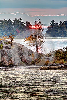 Sun Rising Behind A Rocky Island On Stoney Lake At Burleigh Falls