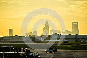 sun rising early morning over charlotte skyline seen from clt ai