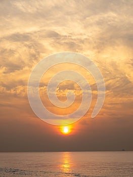 Sun is rising over horizon line with sea view and colorful sky