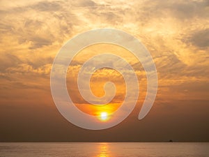 Sun is rising over horizon line with sea view and colorful sky