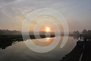 Sun Rising Reflections in Duxbury Bay on a Foggy Morning