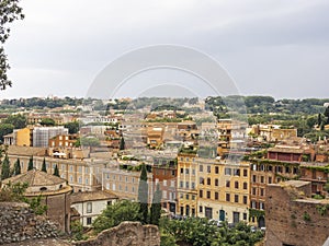 The sun rising on the roofs of Rome in Italy in summer