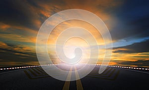 Sun rising sky and asphalt highway use as traveling and journey background photo