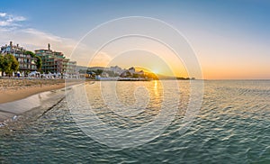 Sun rising at sunrise on a beautiful beach in Sunny Beach on the Black Sea coast of Bulgaria photo