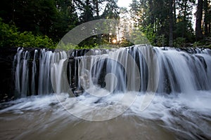 The sun`s rays illuminate the dark gorge photo