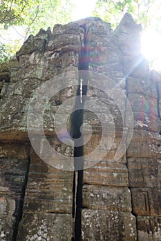 The sun`s rays illuminate the old stonework. Ancient ruins