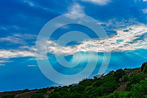 The sun`s rays make their way through the clouds