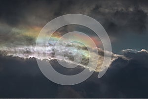 The sun's rays passing through the clouds and shining form an interesting light pattern against the sky