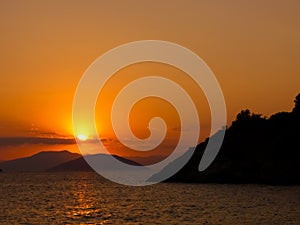 Sun set in the aegean sea photo