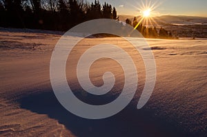 Sun set in mountains with winter and cold scenery