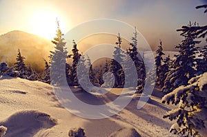 Sun set in mountains with winter and cold scenery