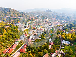 Sun set in old town with historical cityspace buildings in Banska Stiavnica, Slovakia, UNESCO, Aerial photo of calvary.