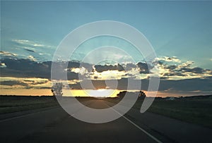 Sun set on open road, North Dakota