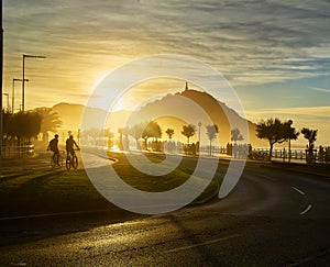 The sun sets behind the Monte Urgull of San Sebastian, Basque Co