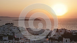 Sunset at the town of chora on mykonos, greece