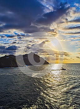 The sun sets behind the Santa Clara Island and The Igueldo Mount. The Concha Bay, San Sebastian. Spain. photo