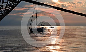 The sun sets on the boats at anchor