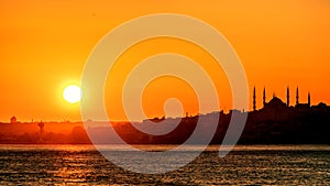 The sun sets over the horizon over the Bosphorus.