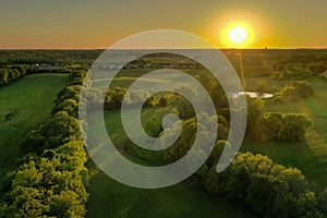 Sun Sets Over Springtime Suburbs and Fields