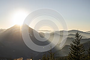 the sun is setting in Austrias lower alps