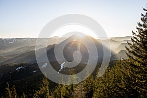 the sun is setting in Austrias lower alps