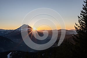 the sun is setting in Austrias lower alps