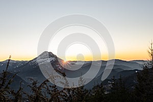 the sun is setting in austrias lower alps