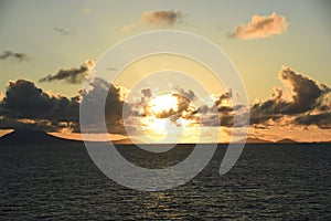 The Sun Setting Behind A Cloud Bank In The Caribbean Near St. Lucia...JPG