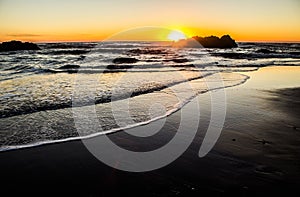 Sun Setting Behind a Seastack on the Oregon Coast