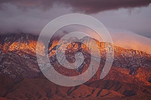 Sun setting on the cliffs of the Sandia mountains.