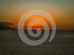 Sun setting over Banderas Bay seen from mirador at Hill of the Cross Viewpoint in Puerto Vallarta, Mexico