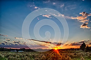 Sun setting over country farm land in york south carolina