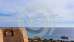 Sun Setting Over Dalt Vila Castle with Vibrant Tourist Trails in Ibiza