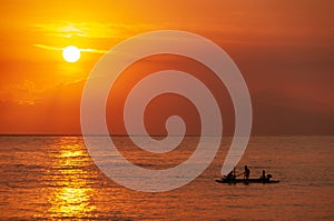 Sun setting over Indonesian fishermen - looking from Lombok towa