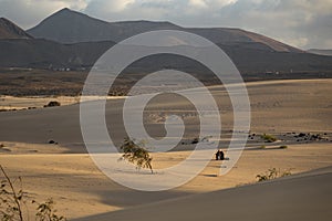Sun setting over the mountains In the Natural Park Corralejo Fuerteventura Canary Islands Spain