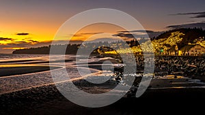 Sun Setting over Semiahmoo Bay and the village of White Rock in British Columbia