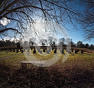 The sun is setting over unesco heritage Woodland cemetery in sweden